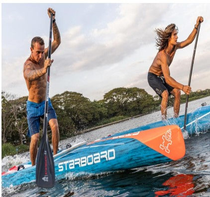 Starboard Sprint Carbon Sandwich race board two men on the water racing