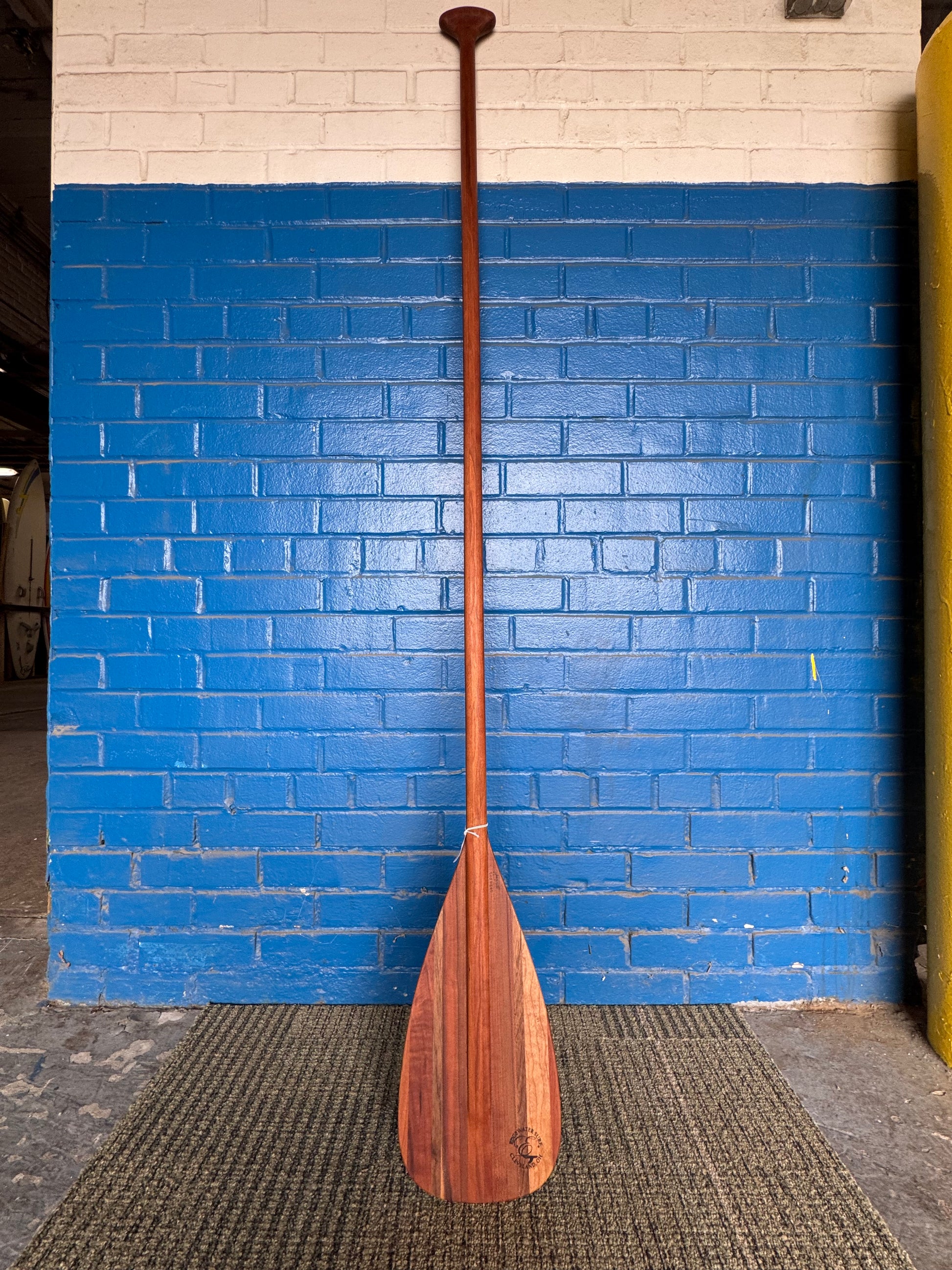 Handmade cherry and walnut wooden stand up paddle by Edgewater Surf