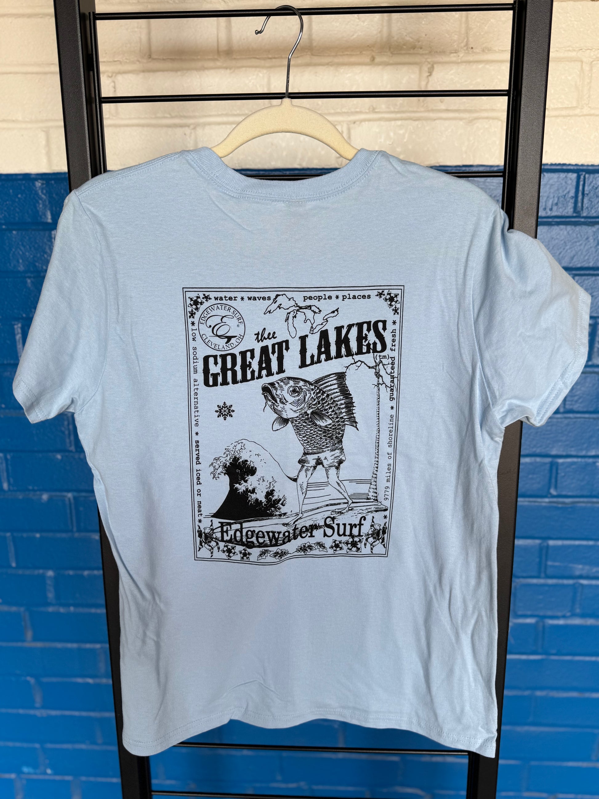 light blue women's shirt at shop. 
